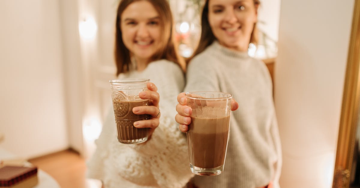 What was the significance of the scene where a few girls are enjoying their new home? - Blur Photo Of Two Young Girls Holding Glasses Of Chocolate Drinks