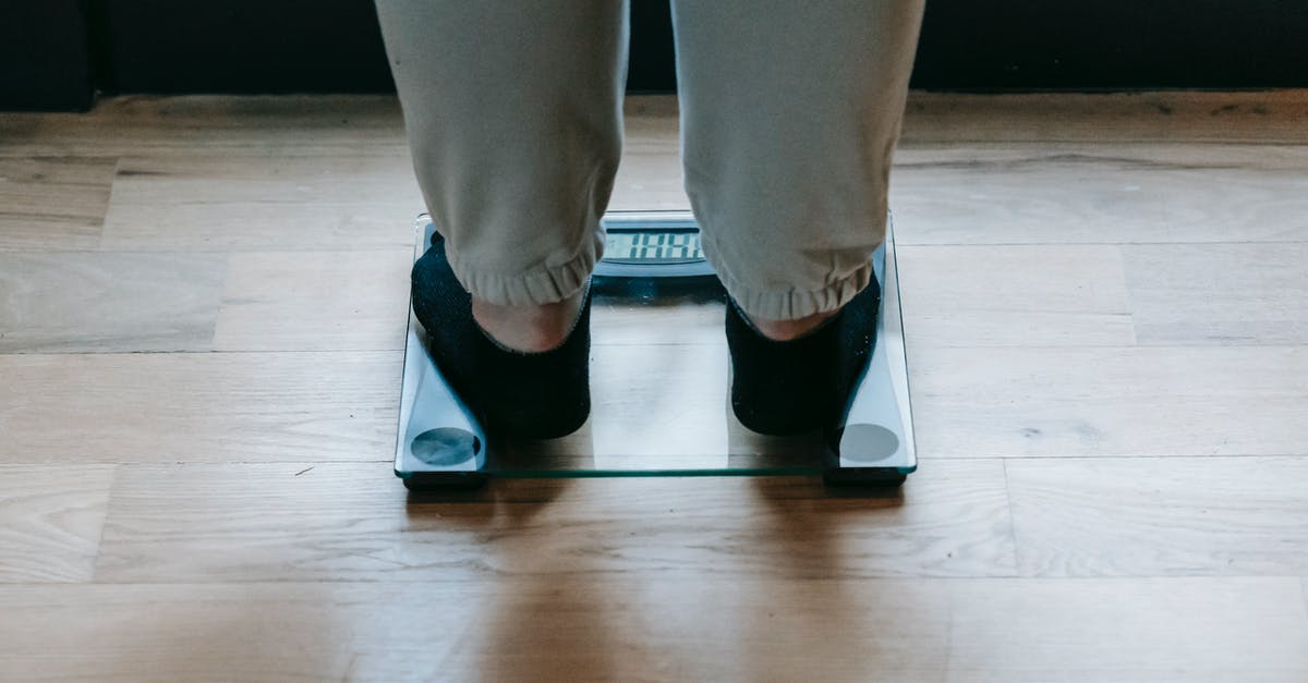 What weighs toward the decision to ignore the gravity change? - Plus size woman standing on scale
