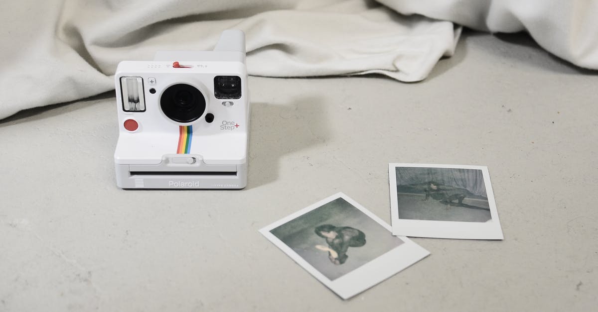 What were the last set of flashes of memory about? - Modern instant photo camera and photos placed on floor