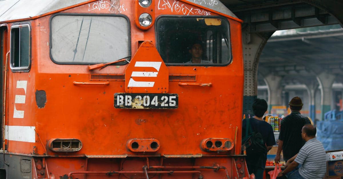 What would Grissom need Axis Chemicals as a front for? - Close-up of an Orange Train with Graffiti