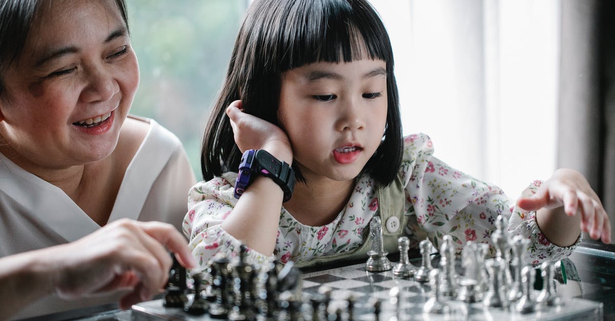 What’s the logic behind the Elder asking to kill Winston? - Adorable ethnic child doing move while playing chess with grandmother
