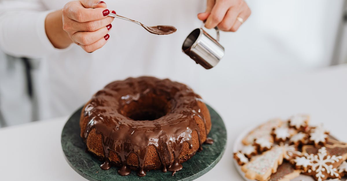 Where are the spoons? - Person Holding Stainless Steel Fork and Knife Slicing Chocolate Cake