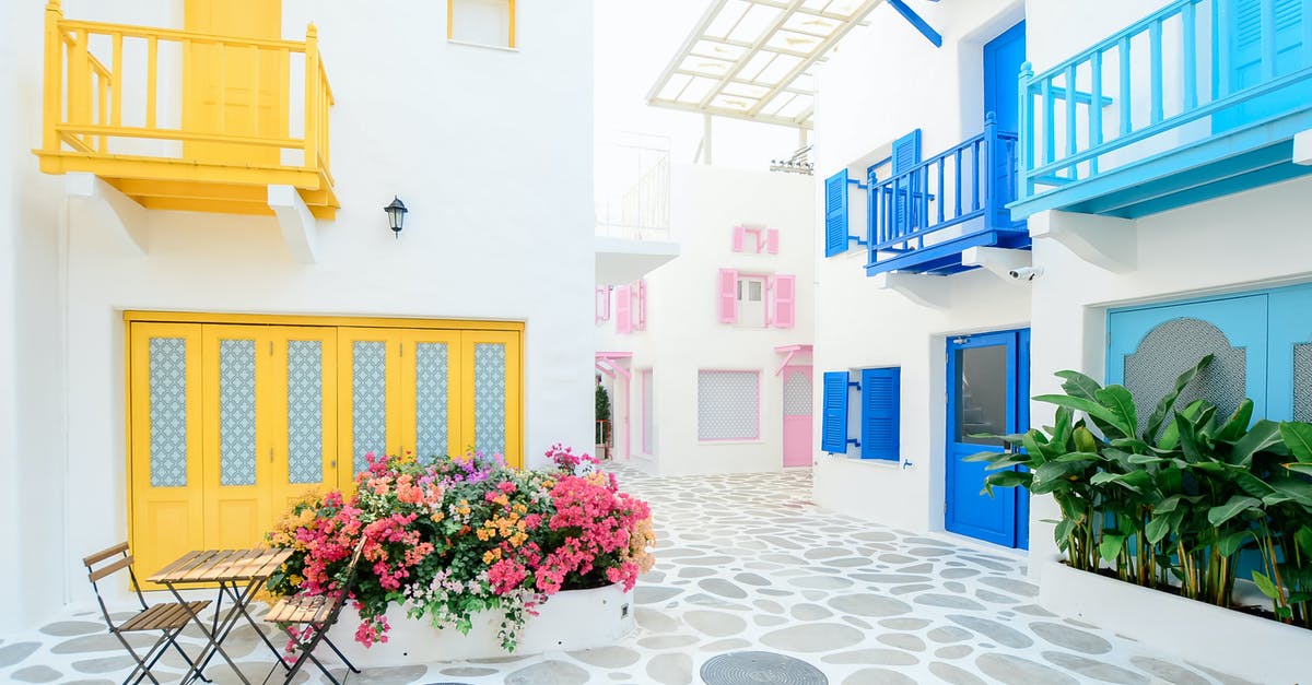 Where did all the furniture that was in the villa come from? - Architectural Photography of Three Pink, Blue, and Yellow Buildings