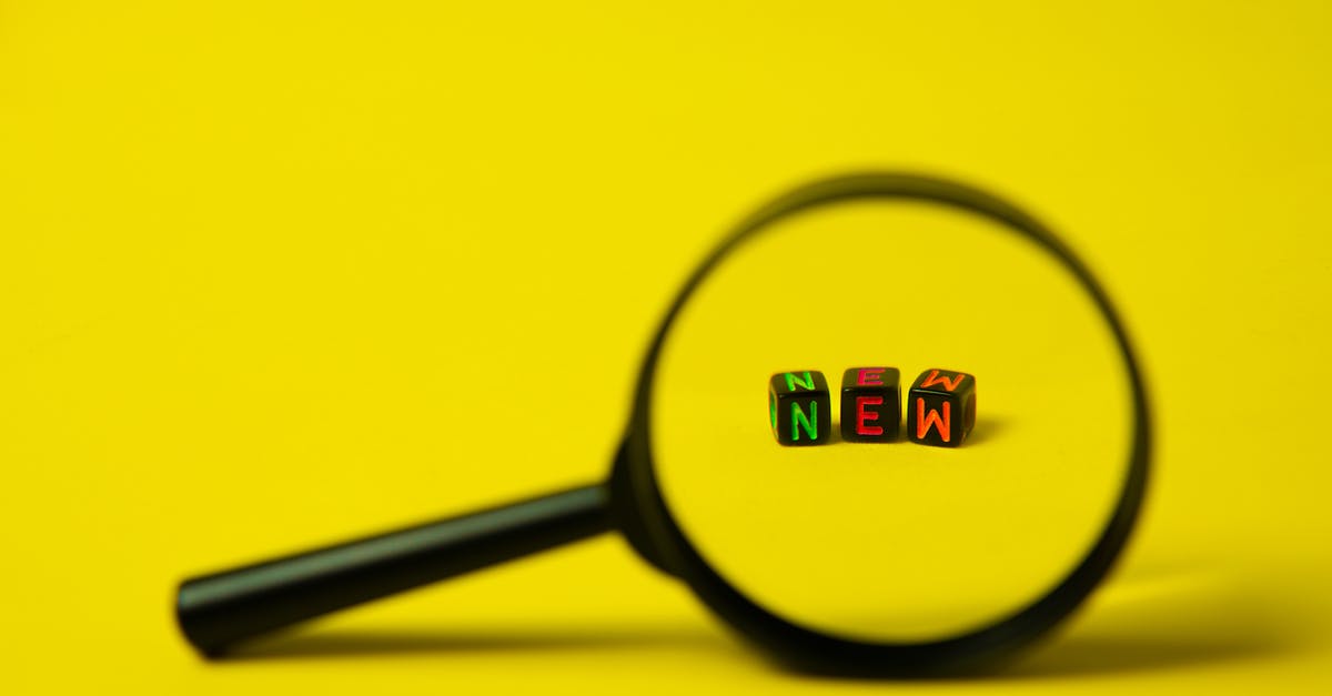 Where did Taylor Mason find their new partner? - Concept image of big black magnifier with word new in form of cubes against yellow background