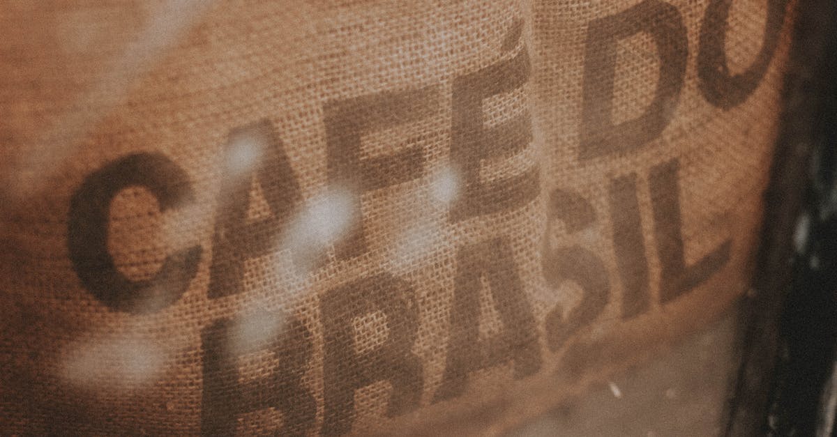 Where do production houses find tailors and how much do they cost? - High angle closeup of burlap bag with coffee beans and inscription Cafe Do Brasil