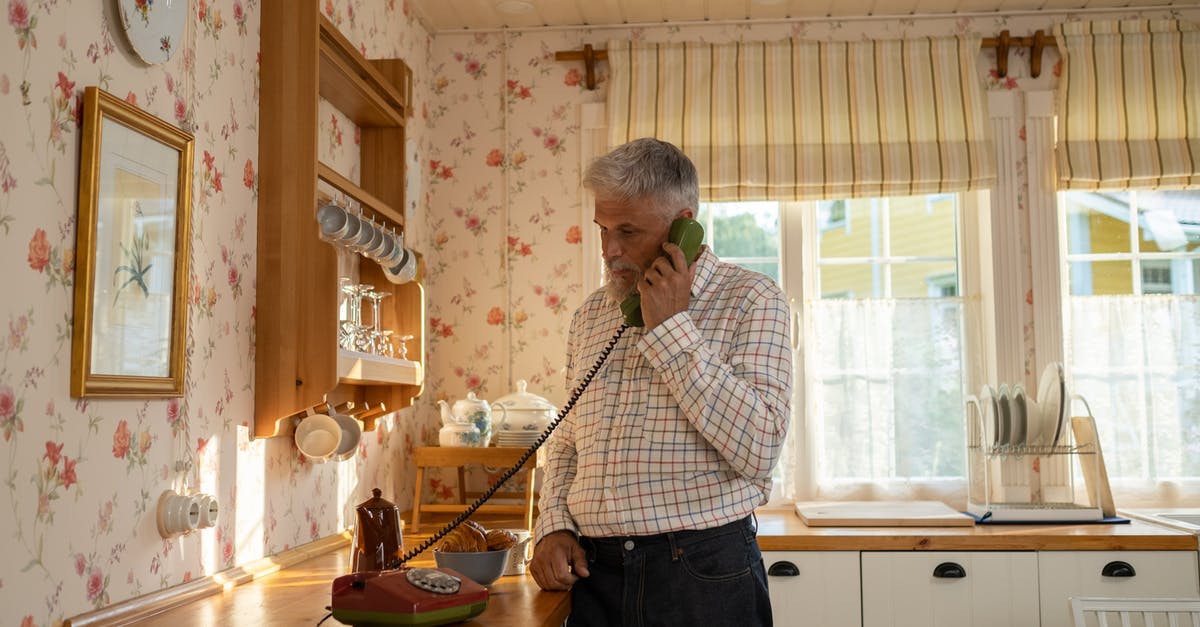 Where do the timelines of X-Men: The Last Stand and X-Men: Days of Future Past lie exactly? - Senior Man Talking on Landline Phone in Old-Fashioned Kitchen