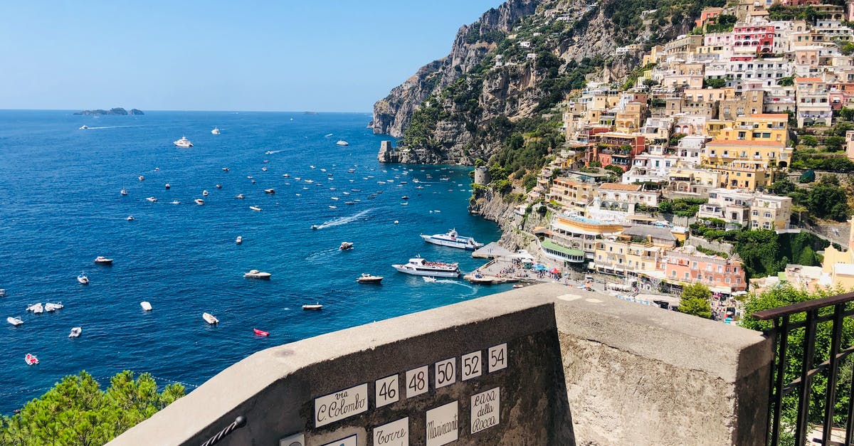 Where is Sator between the Vietnam Yacht and Italy? - View from balcony on Positano town on tropical Amalfi coast with boats sailing at sea on sunny day