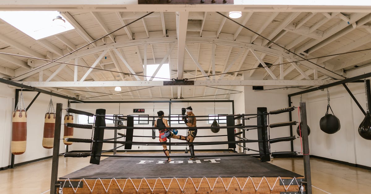 Where is Turkish's boxing office? - A Man and a Woman Sparring Inside the Boxing Ring