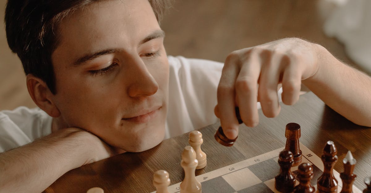 Which board game does Nash play in the movie "A Beautiful Mind"? [closed] - Woman Holding Brown Wooden Chess Piece