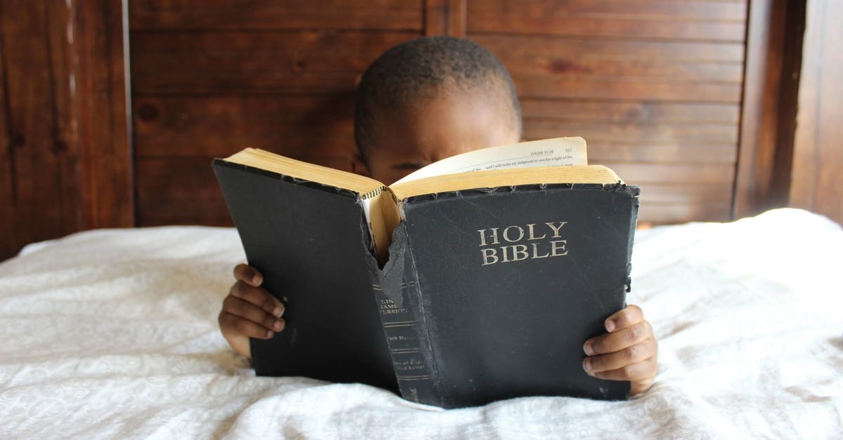 Which book about encryption did Christopher give Alan when he was a child? - Photo of Child Reading Holy Bible
