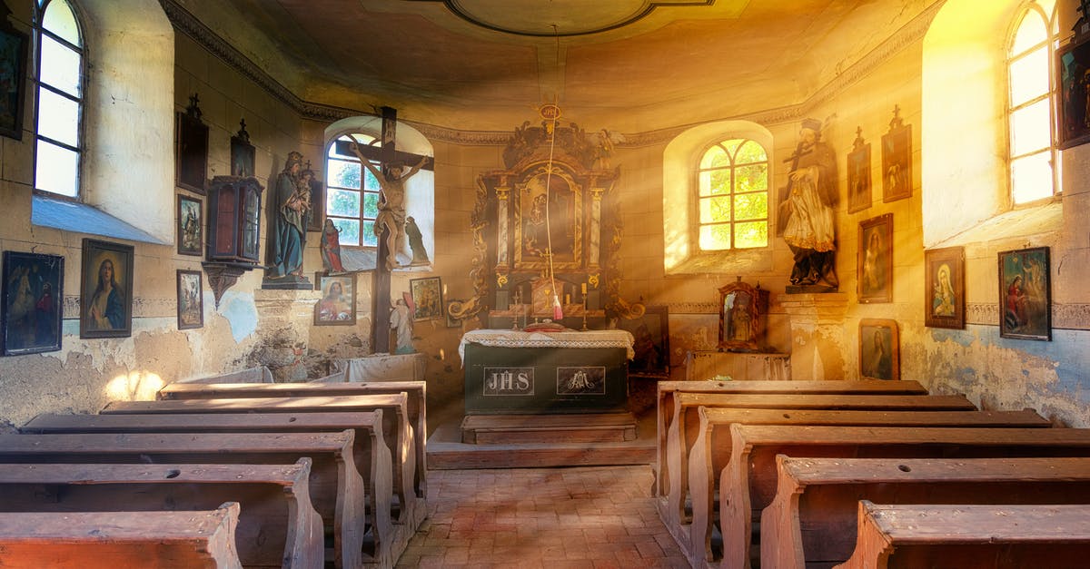 Which Church is Ray a member of? [closed] - Interior of old catholic church with bright rays of sun