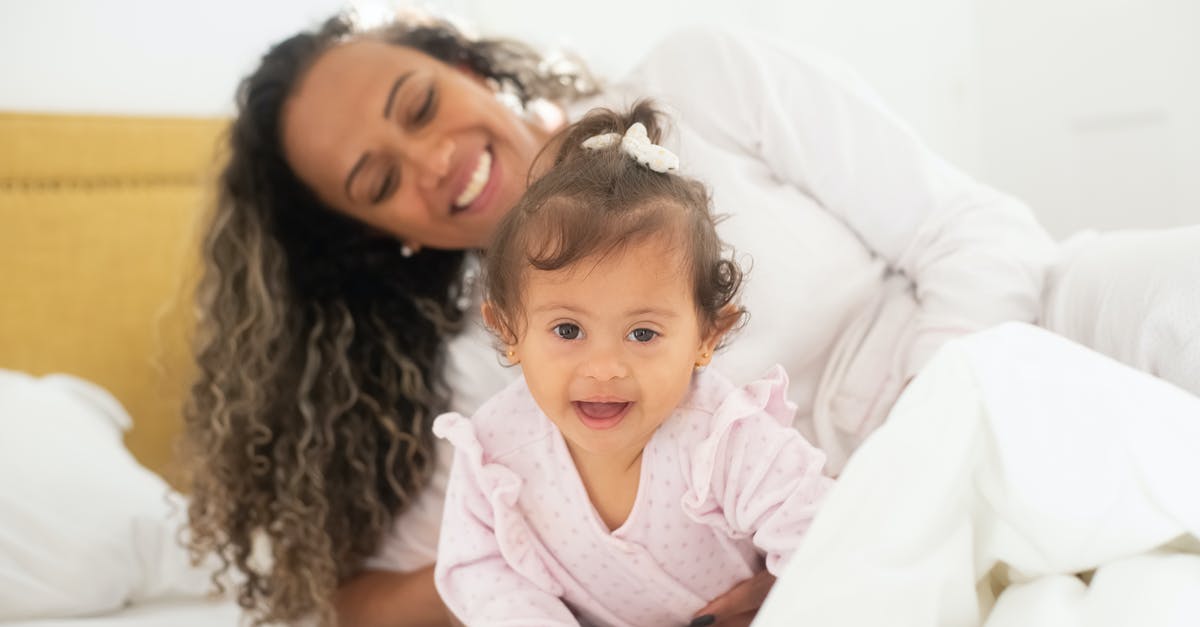 Which girl Parry was referring to after waking up? - Photo of a Mother Waking Up with Her Daughter on the Bed
