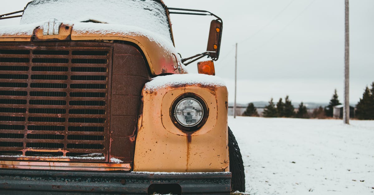 Which season/episode is the scene where Walter White enters the CT scanner/radiation therapy machine [closed] - Yellow old timer truck with headlight covered with frost parked on snowy terrain against trees in rural terrain on winter day