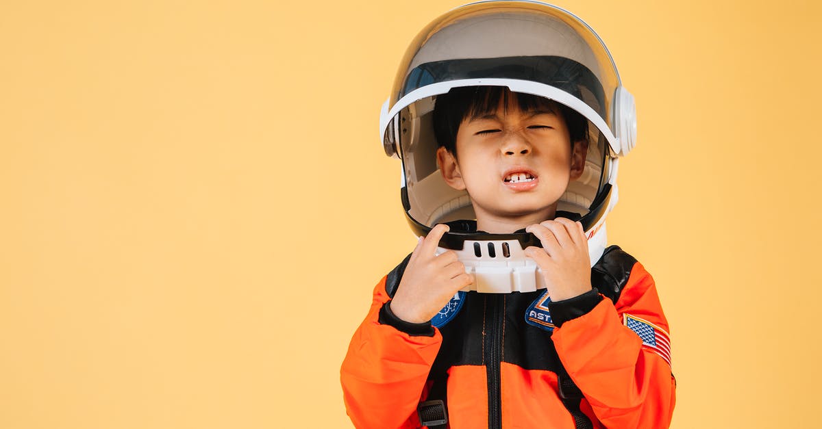 Who are the little guys wearing orange robes? - Asian kid wearing astronaut helmet