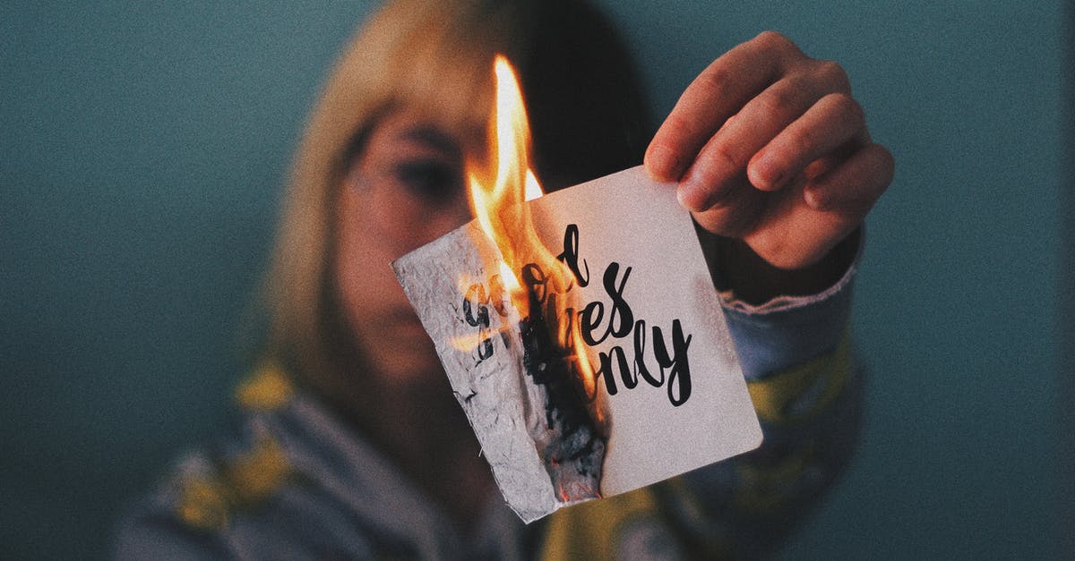 Who are these women arriving at the end of Antichrist? - Anonymous woman burning paper with inscription