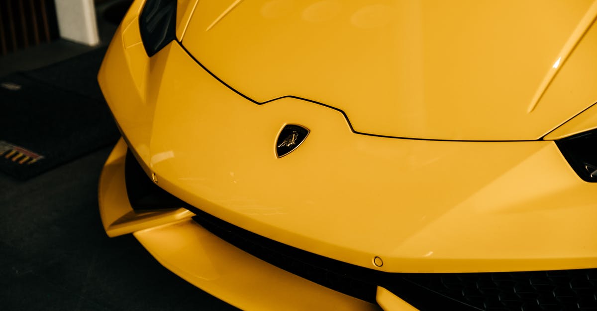 Who ended up on the hood of the Serenity? - Yellow Ferrari 458 Italia on Black Asphalt Road