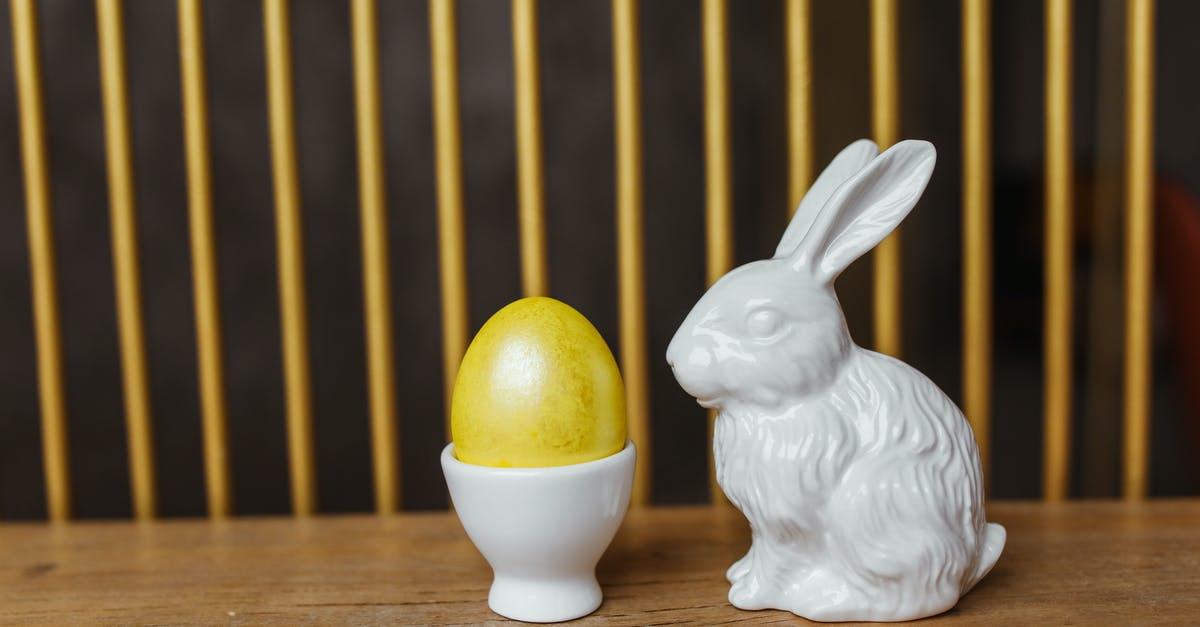 Who Framed Roger Rabbit Allegory? - White Ceramic Rabbit Figurine on Brown Wooden Table
