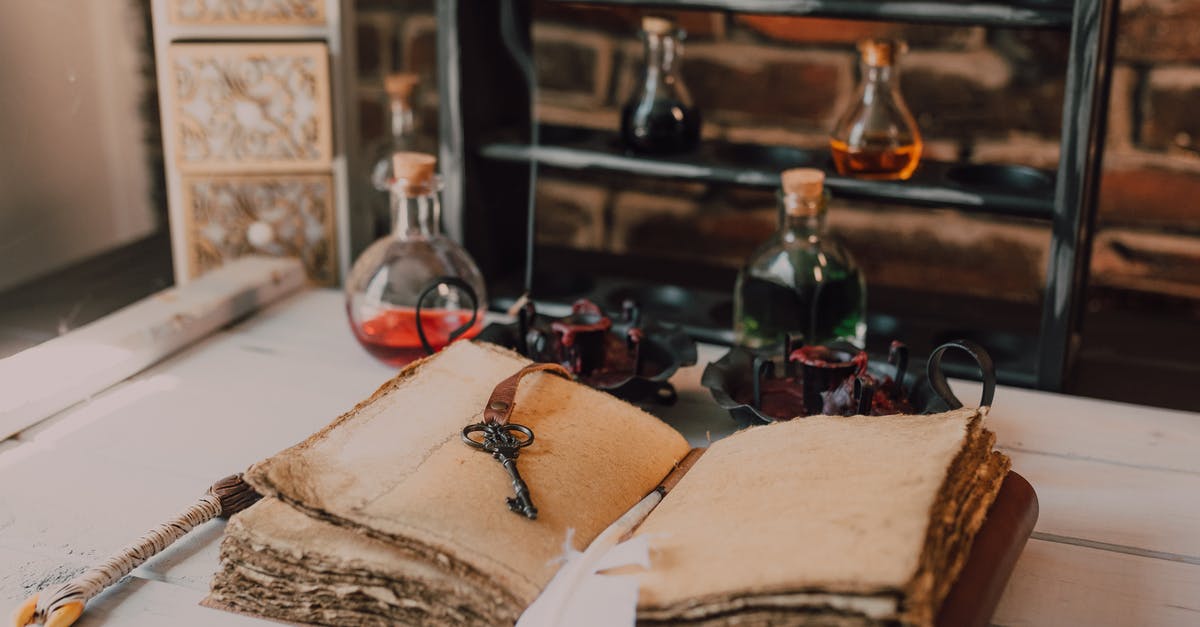 Who gave the Invisibility Cloak to Harry Potter? - An Old Book and Candles on Wooden Table with Glass Bottles