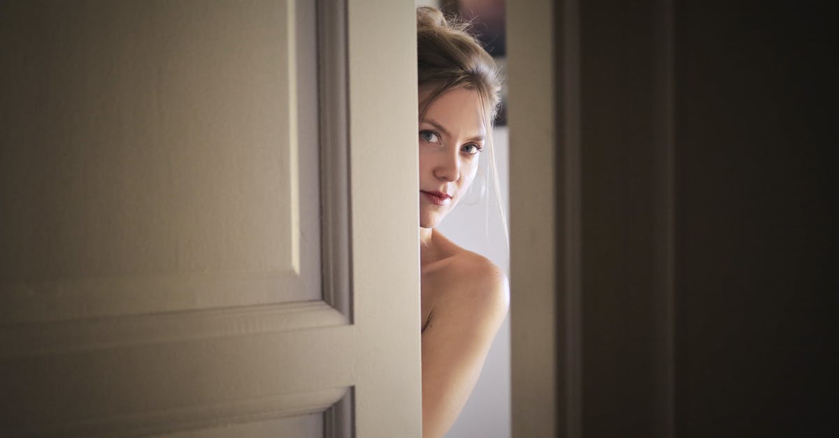 Who held the girl in the secret room? - Photo of Woman Behind Door