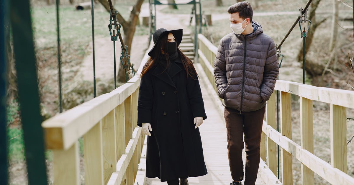Who is Greer talking to in Episode 19, Season 2? - Couple walking along bridge in park