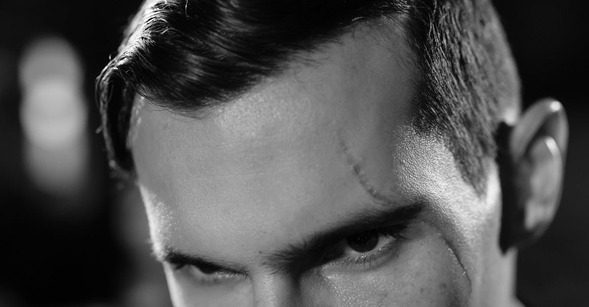 Who is the actor with the most screen time in a movie who was credited under a generic character description rather than a name or nickname? [closed] - Extreme Close-Up Photo of Man with Scar on his Face