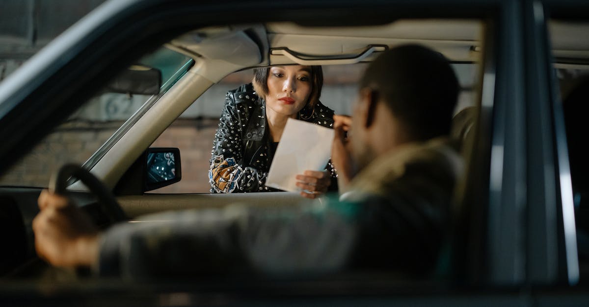 Who is the man in a car talking to Dry Eye? - Woman Holding a Paper Beside a Car Window