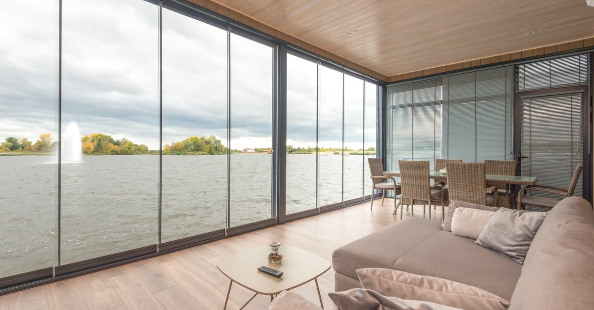 Who really designed The Lake House and under what considerations? - Interior of contemporary house on lake on cloudy day