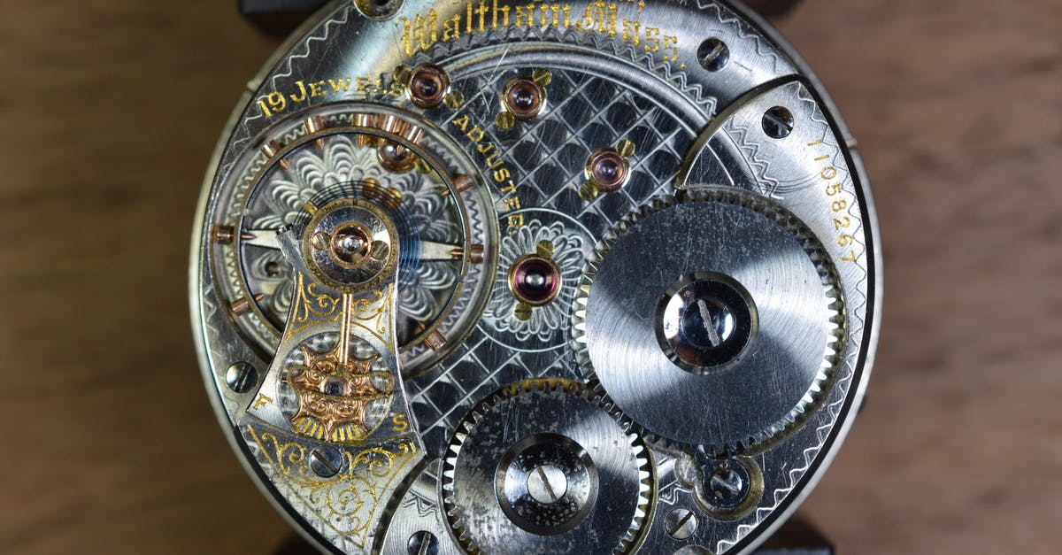 Who really owns the pocket watch, Richard or Elise? - Round Gray Skeleton Watch on Brown Pad