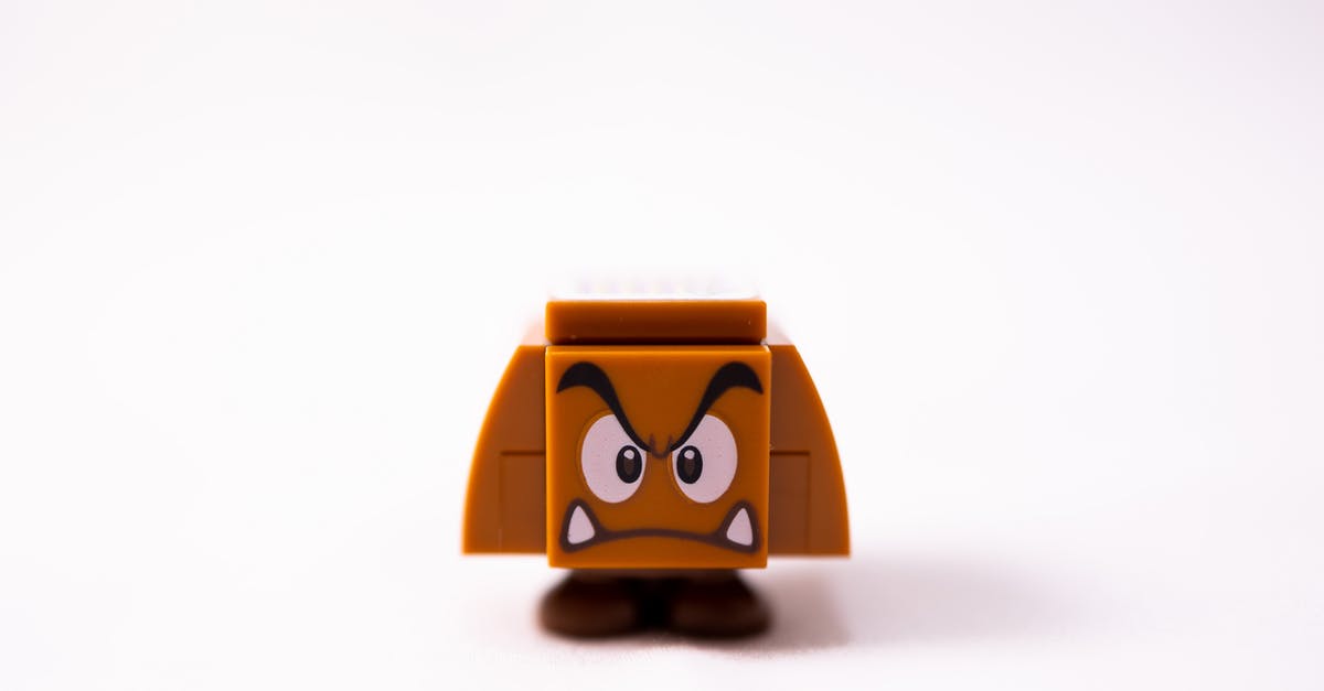 Who voices the character "Finger" in The Fifth Element? - Small brow toy of evil mushroom made of plastic details against white background
