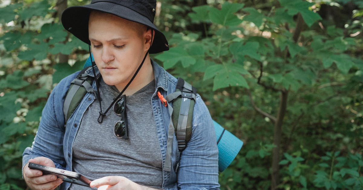 Why an observatory keeps being used as a location to advance plot in Hannibal? - Serious young man using tablet in forest during hiking tour