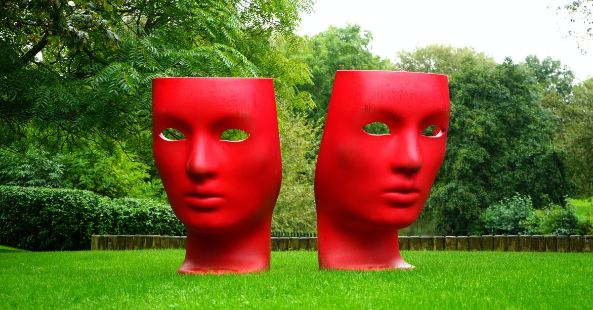 Why are comedies shorter than dramas? - Red Human Face Monument on Green Grass Field