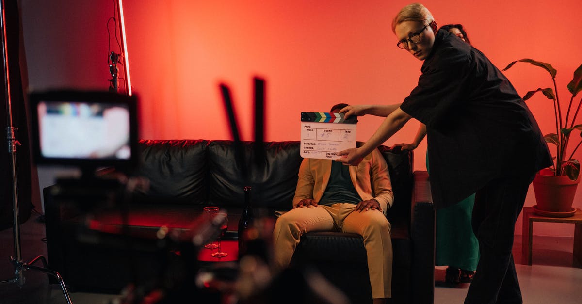 Why are some actors uncredited in certain films? - A Woman Holding a Clapperboard 