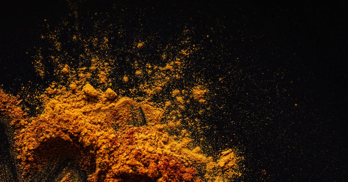 Why are sound effects done so different from reality? - Composition of multicolored ground spices spilled on black background