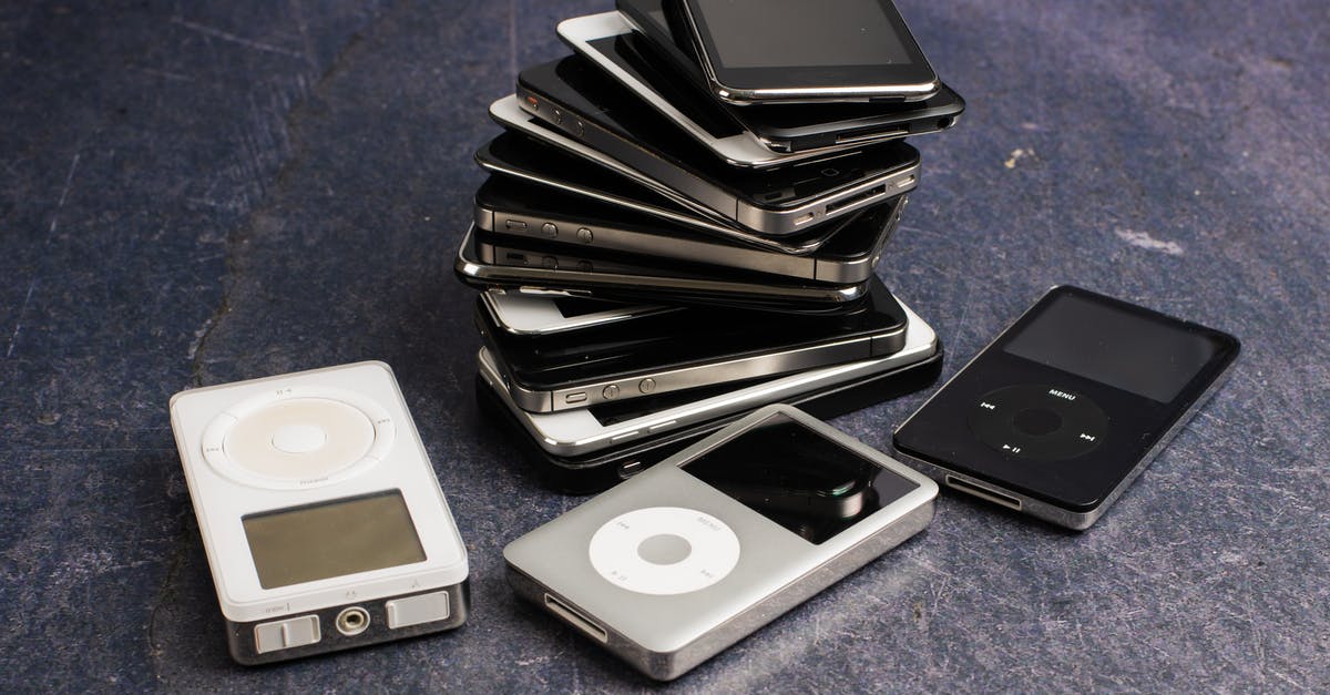 Why are there different audio levels for different languages? - Assorted portable media players and heap of aged cellphones with black screens on gray background