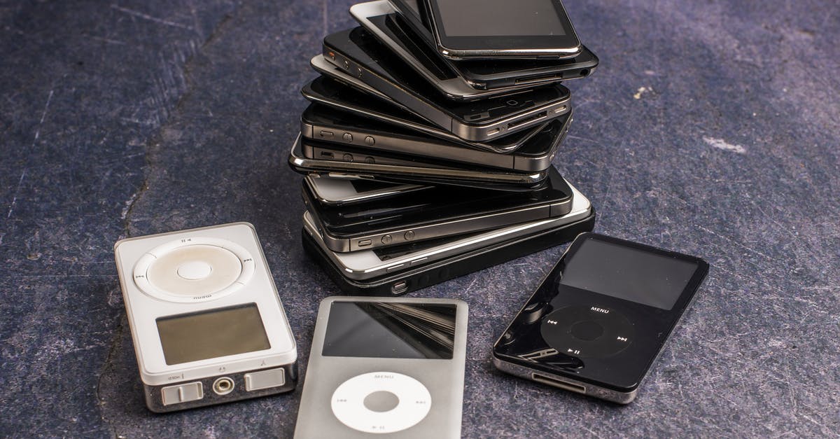 Why are there different audio levels for different languages? - Various music players and pile of aged smartphones