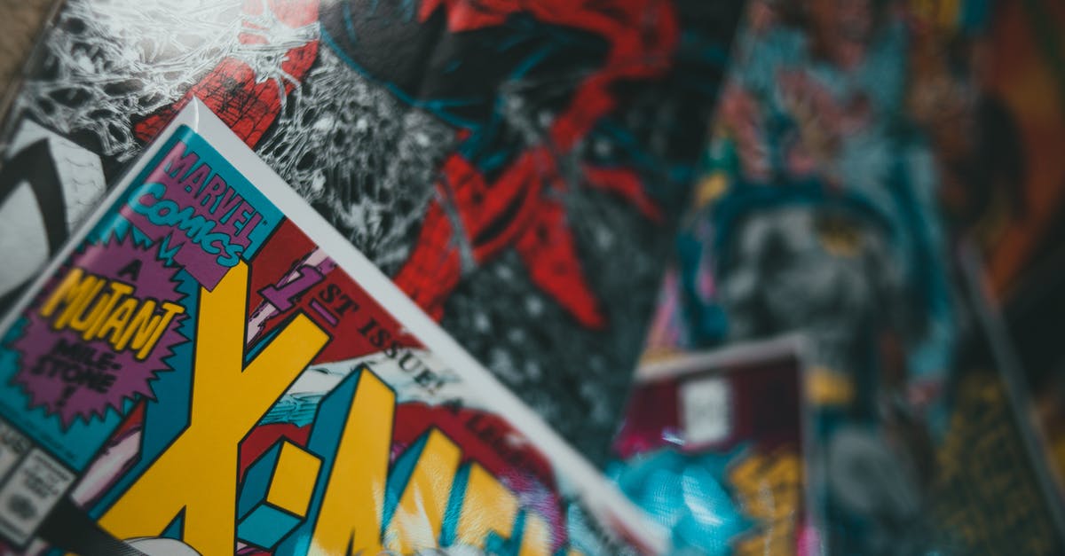 Why are there so many superhero movies made in recent decades? - From above closeup of collection of various comic books with colorful covers spread out on surface