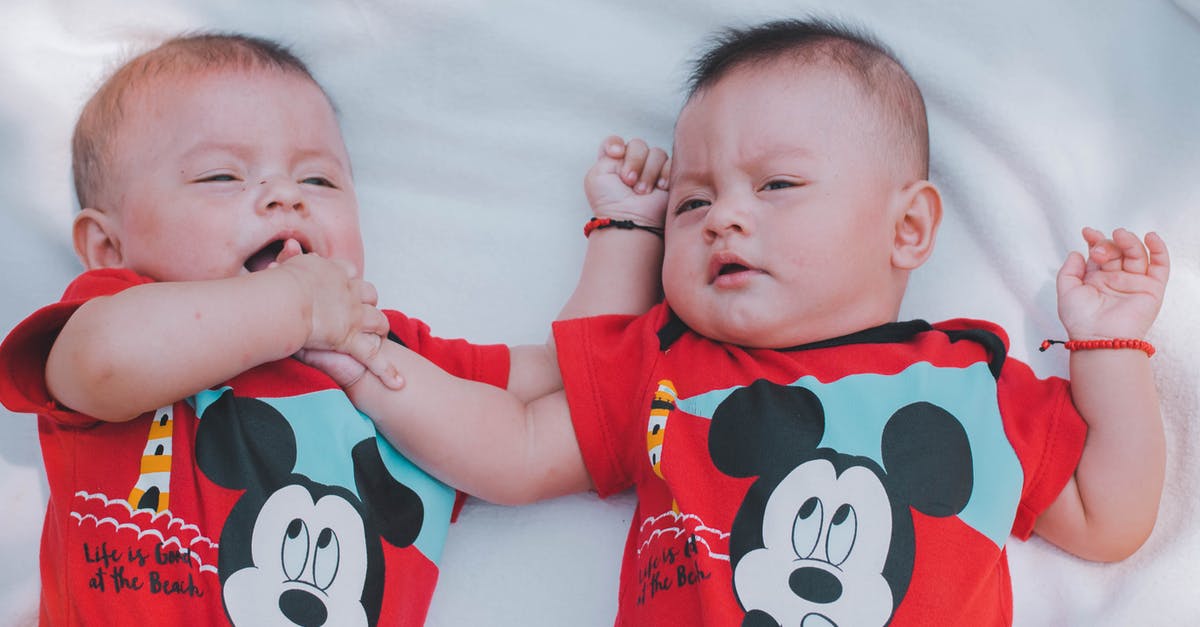 Why are twins often cast for young roles? - Two Babies Wearing Red Mickey Mouse Shirts