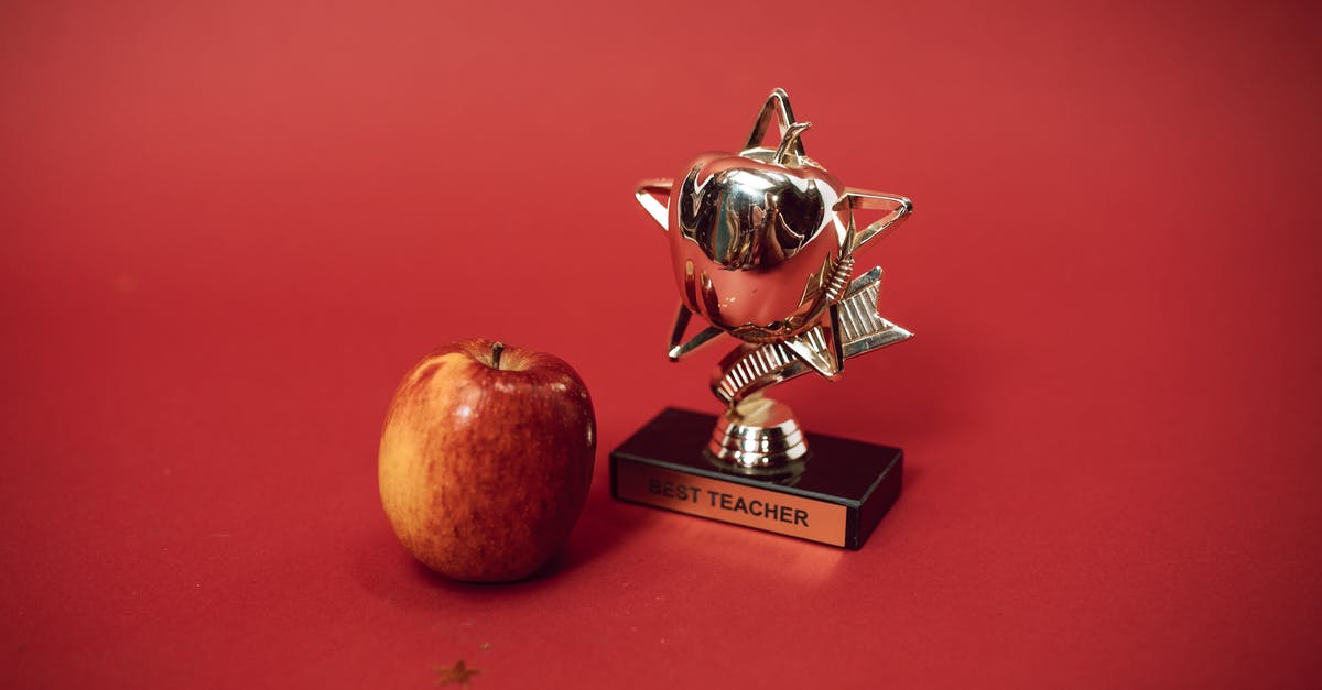 Why aren't the front of Oscar winner envelopes marked with the award they're for? - A Best Teacher Trophy and an Apple