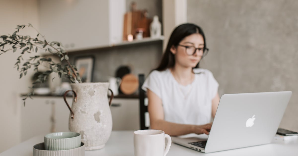 Why aren't they using the "link" to give the robots instructions? - Focused young businesswoman working remotely at home