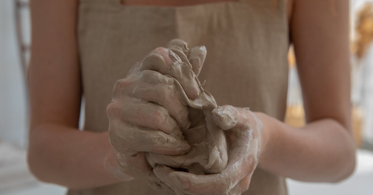 Why couldn't Ransom make an anonymous call? - Crop faceless woman kneading clay in workshop