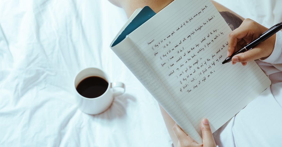 Why did all the guest students take carriages to the Yule Ball? - Top view of unrecognizable woman sitting on bed with legs near cup of coffee and writing on notepad with pen while resting at home