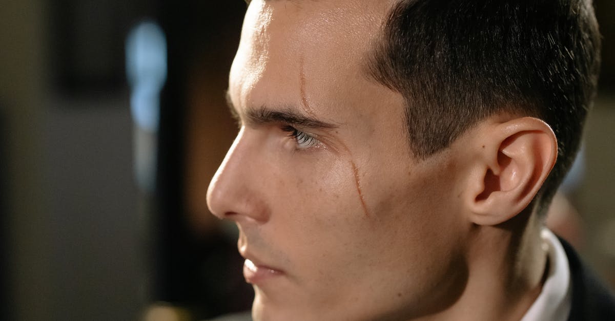 Why did Bruce get suspicious of Oswald? - Close-Up Photo of Man with Scar on his Face