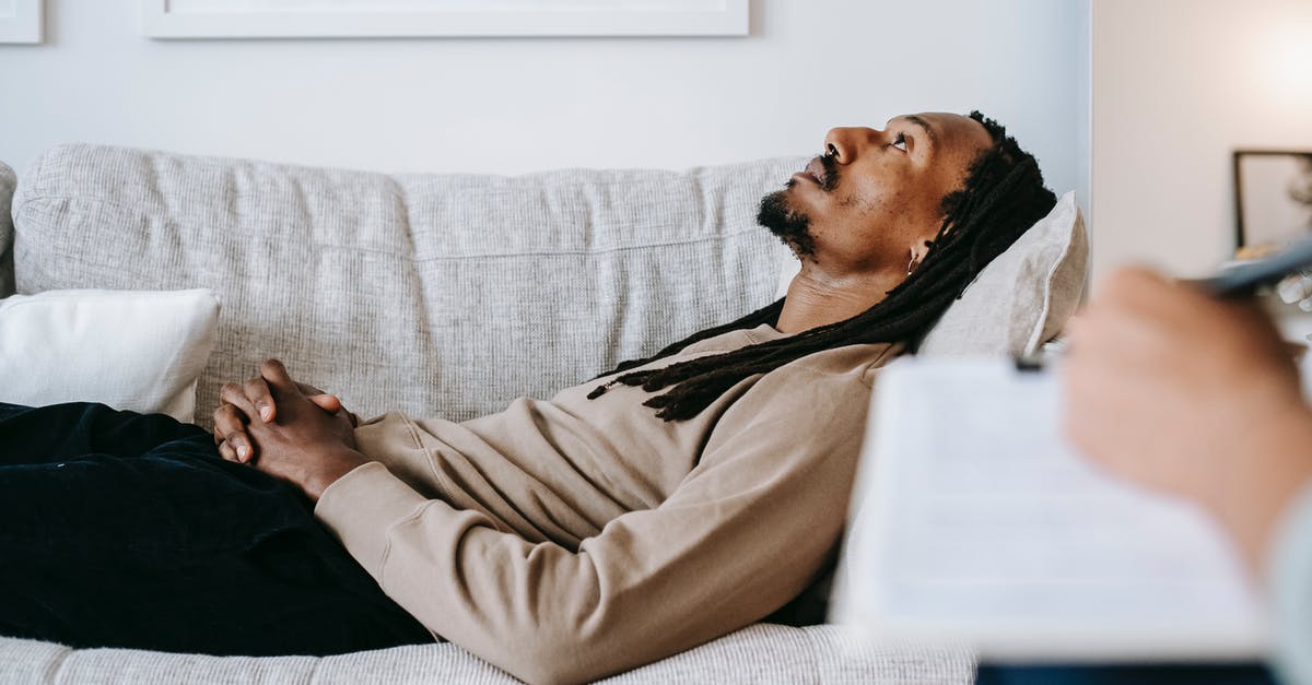 Why did Ethan Hunt dream of Solomon Lane with a beard? - Side view of thoughtful African American male with beard and mustache relaxing and dreaming on sofa in lounge