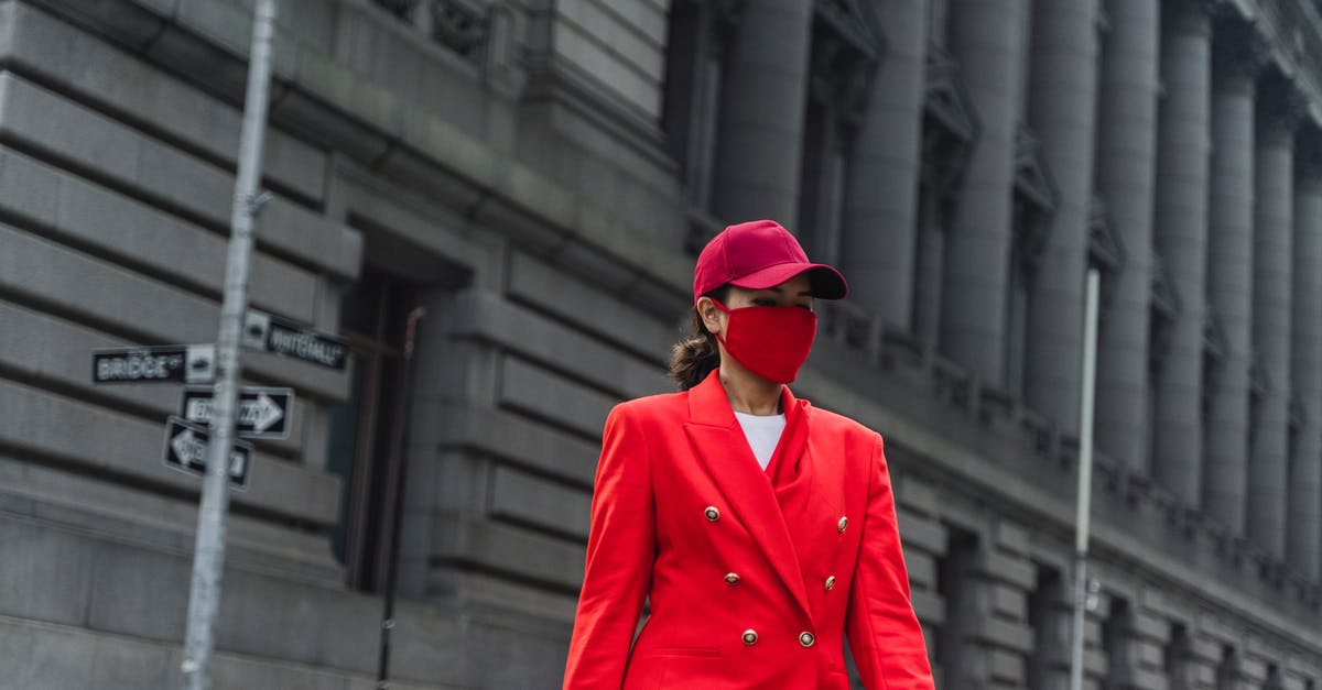 Why did Francesca Campbell betray Red? - Close-Up Shot of a Woman in Red Blazer and Face Mask