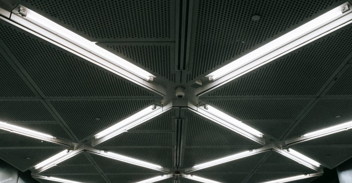 Why did Hendricks jump from the parking structure at the end of the fight scene in MI4? - Metal ceiling with glowing lamps in underground garage