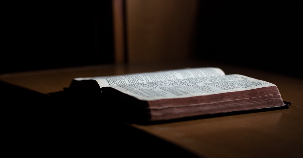 Why did John Brittle have Bible pages sewed into his shirt? - Close-up of Paper Against Black Background