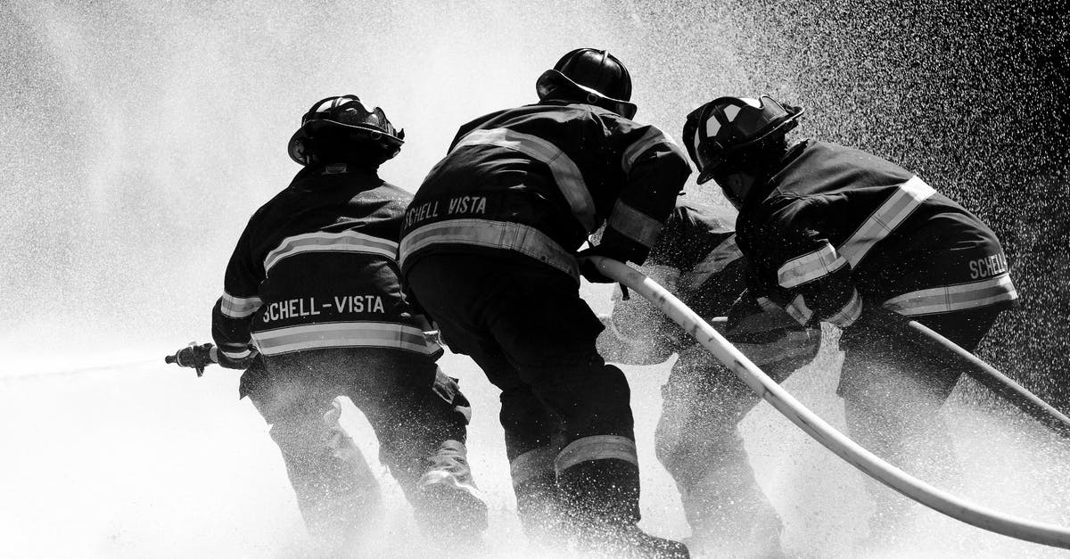 Why did Kurt Connors save Spider-Man? - Grayscale Photo of Firemen