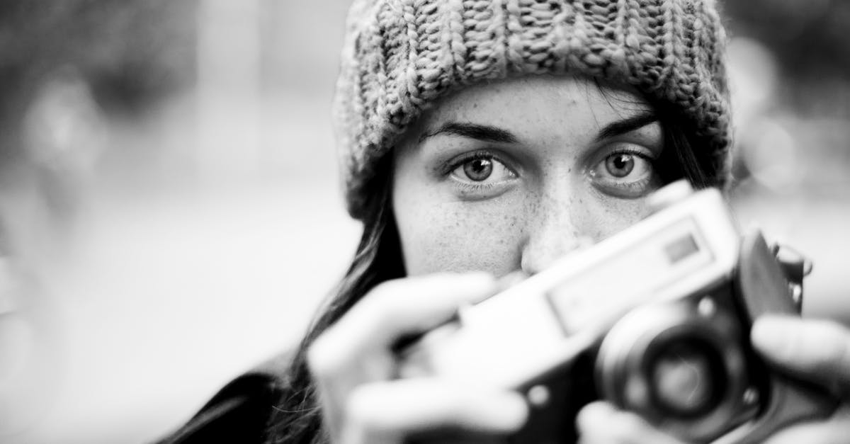 Why did Lex Luthor shoot two missiles? [closed] - Grayscale Photography of Woman Holding Camera