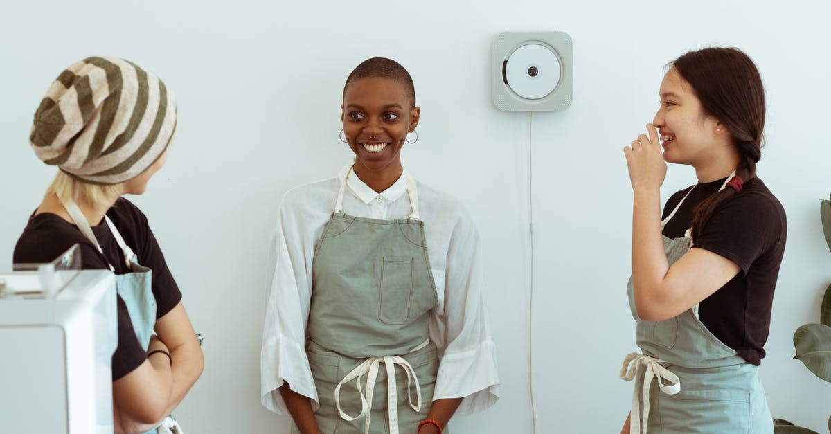 Why did Poppy ask Angel to kill his friend Charles, in the beginning of the movie? - Positive young diverse female baristas in apron uniforms communicating with shy newcomer during break at work