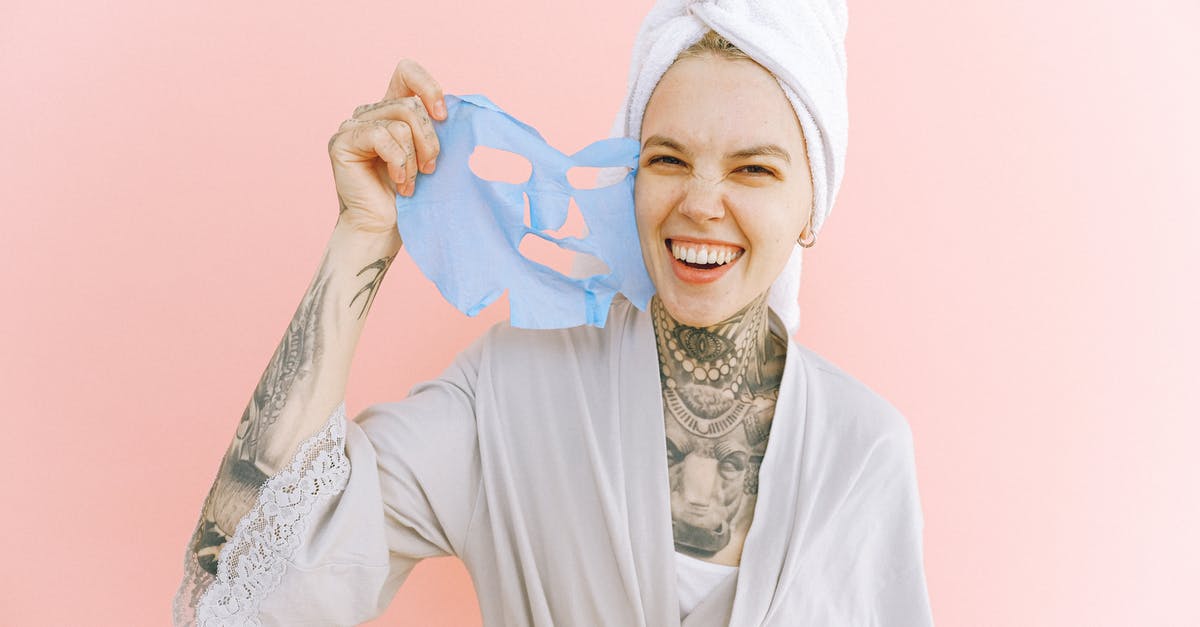 Why did Quint have the tattoo removed? - Happy woman removing face mask after taking bath